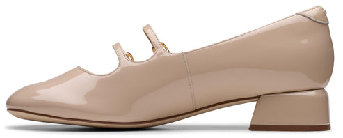Pale pink patent leather Mary Jane shoe with two thin straps and a block heel.