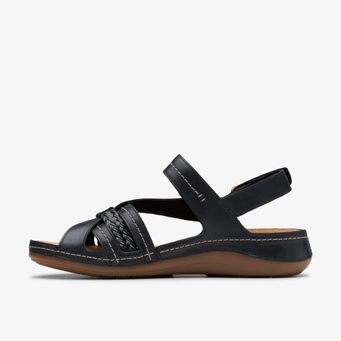 Side view of a black sandal with a braided strap and ankle strap.