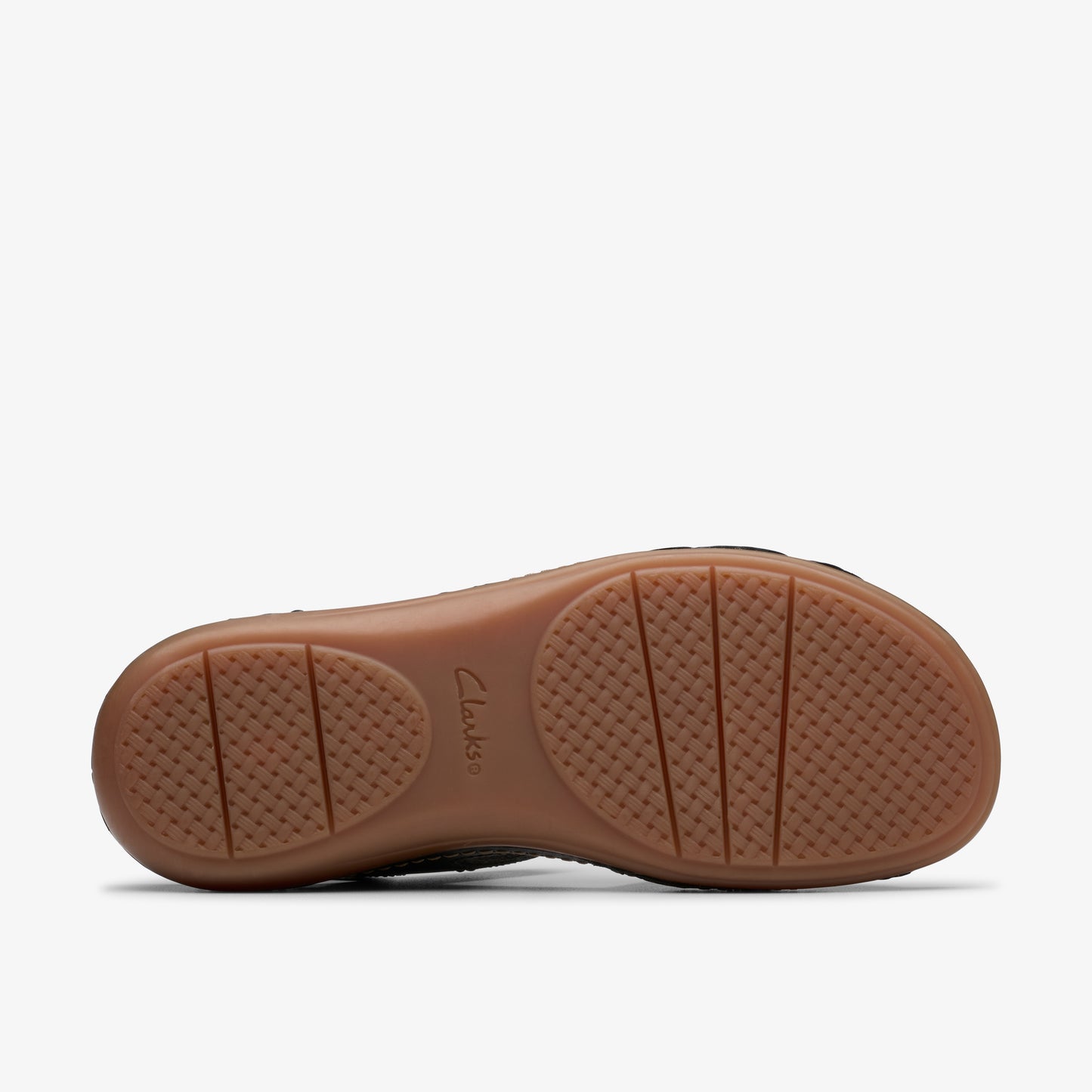 Shoe sole with brand text, brown treads, and round toe area.