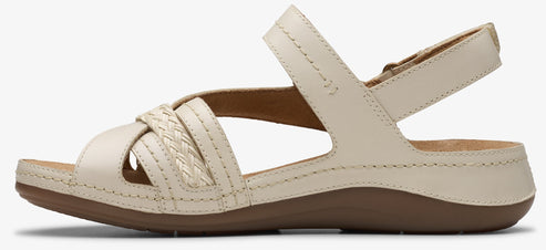 Beige sandal with woven straps and ankle strap.