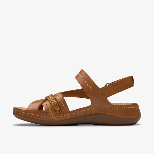 Tan leather sandal with braided detailing and adjustable ankle strap.
