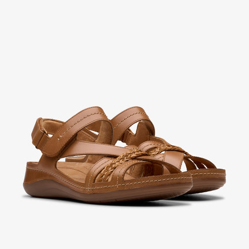 Pair of caramel-colored leather sandals with hook-and-loop closure and woven detail.
