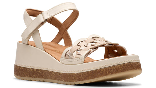 Off-white wedge sandal with adjustable ankle strap and woven vamp.