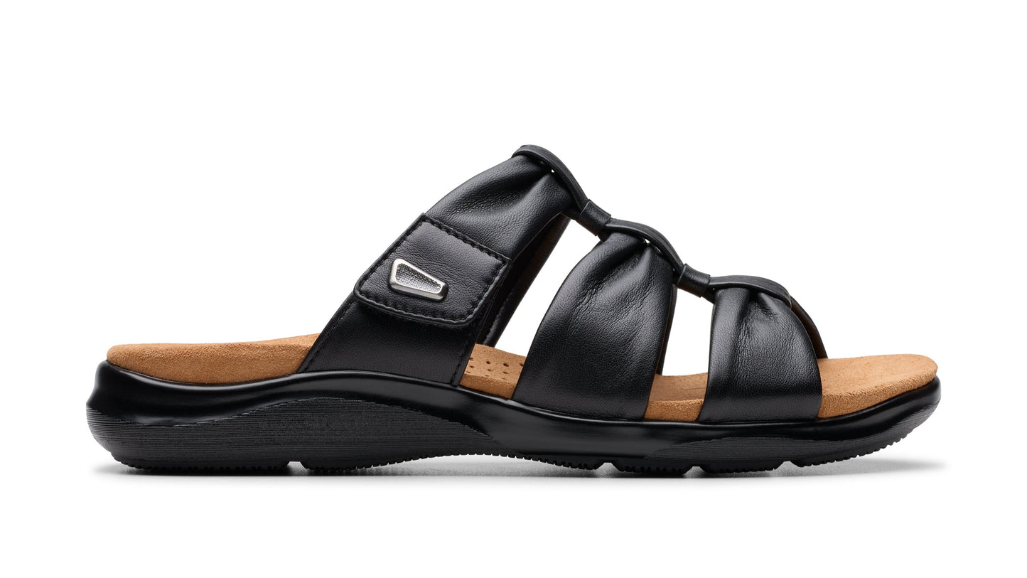 Black sandal with adjustable hook and loop strap, and gathered leather straps.