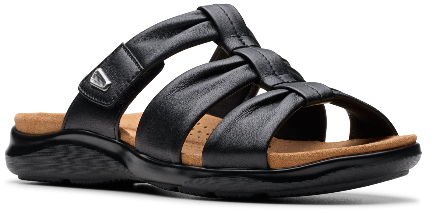 Black leather sandal with multiple straps and adjustable velcro closure.