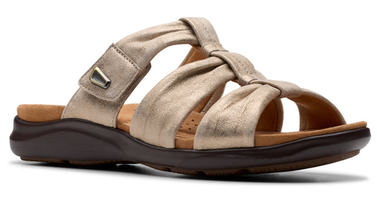 Gold sandal with knotted strap, adjustable hook-and-loop closure, and dark brown sole.