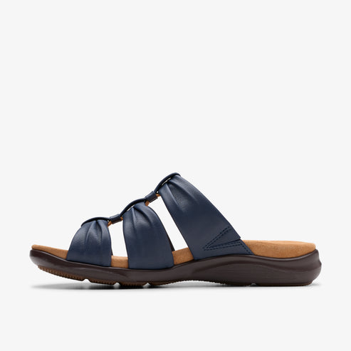 Navy blue sandal with three gathered straps and brown sole.