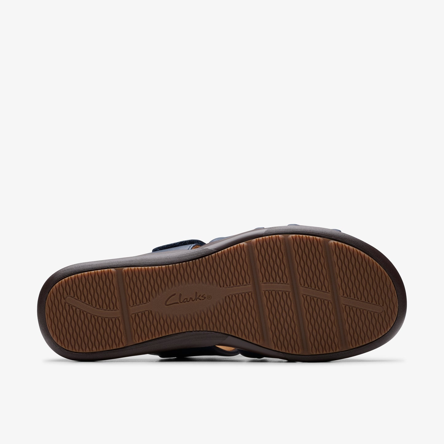Brown sandal sole with textured grip and Clarks logo.