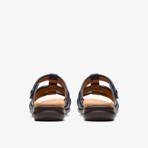 Back view of a pair of blue slide sandals with brown insoles and dark soles.