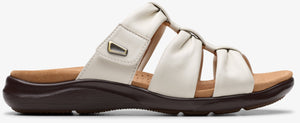 Off-white slide sandal with a dark brown platform sole.