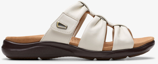 Off-white slide sandal with a dark brown platform sole.