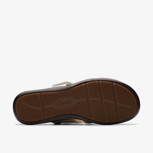 The bottom of a brown sandal, showing the textured sole.