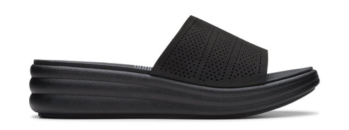 A black, wedge-heeled sandal with a perforated upper.