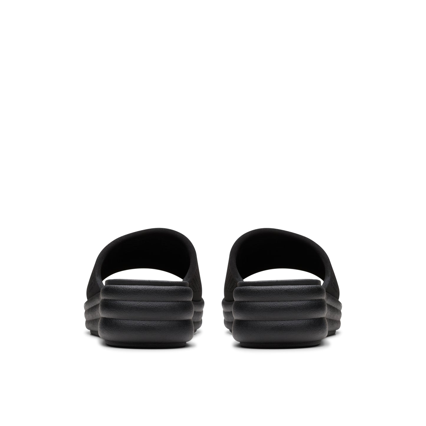 Pair of black slides, rear view, ridged soles.