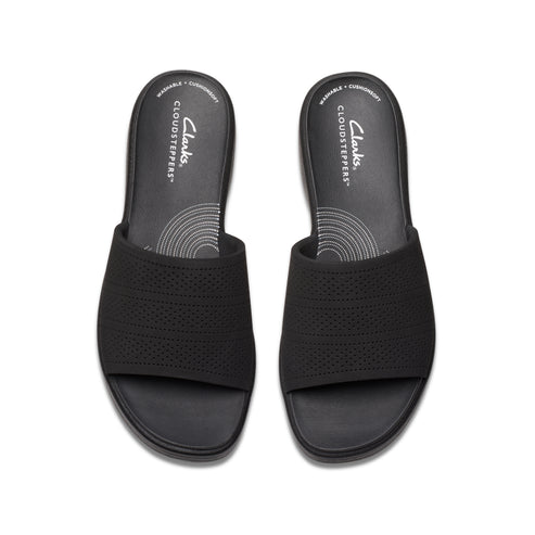 Overhead view of a pair of black slide sandals with a patterned strap.