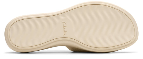 Sole of a light beige shoe with a textured pattern.