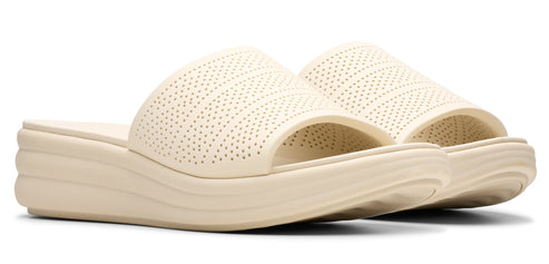 Pair of off-white platform slide sandals with perforated uppers.