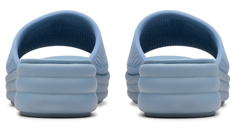 Pair of blue platform slide sandals, rear view.