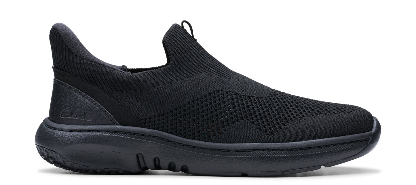 A black slip-on shoe with a knit upper and a thick, rounded sole.