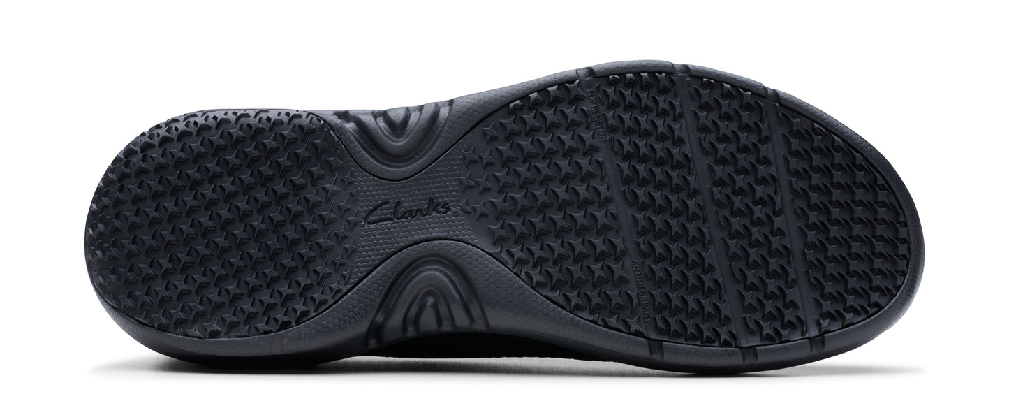 A black shoe sole with a textured grip pattern.