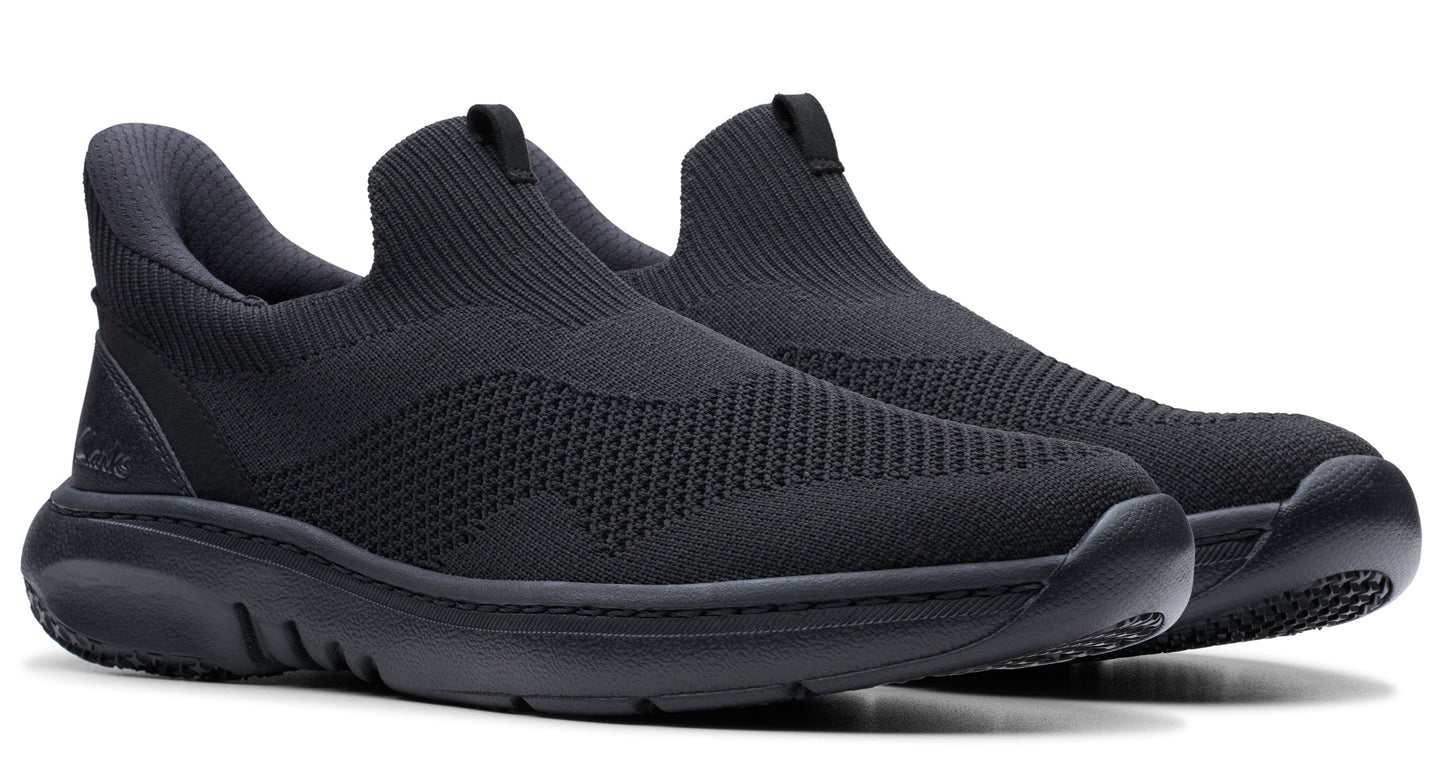 A pair of black knitted sock sneakers with black soles.