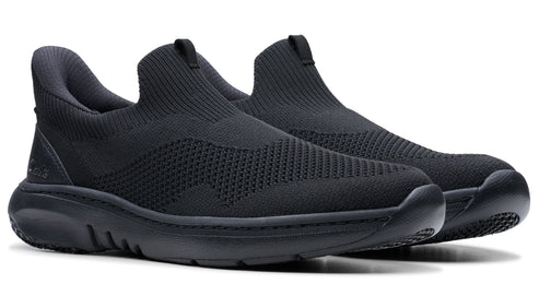 A pair of black knitted sock sneakers with black soles.