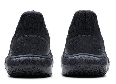 Pair of black shoes, view from the back, with visible soles.