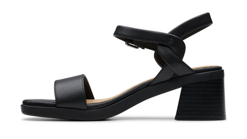 Black leather block heel sandal with an ankle strap.
