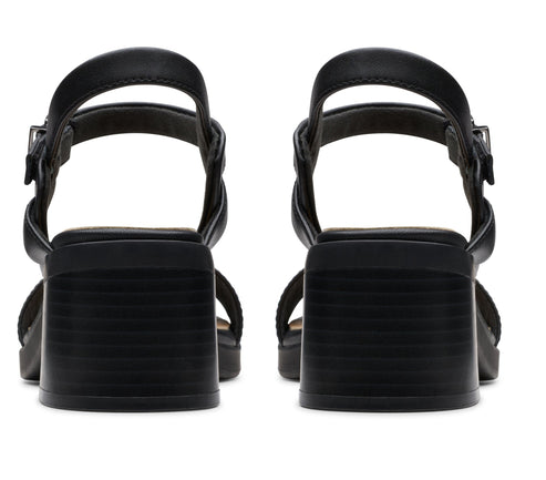 Pair of black block-heeled sandals, rear view.