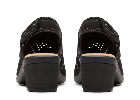 Pair of black, open-backed heeled shoes, back view.