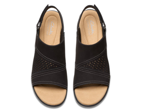 Pair of black, open-toe, slingback sandals with decorative stitching.