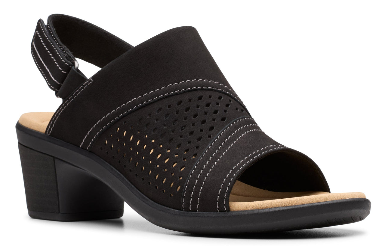 Black sandal shoe with a thick heel, light tan insole, and an upper with a perforated design and a back strap.