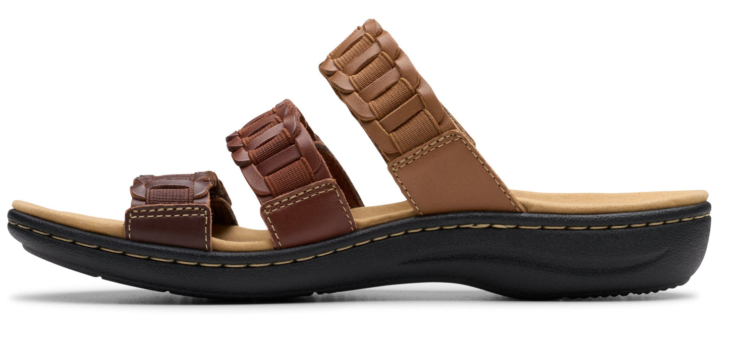 A three-strap sandal in brown with woven details on the straps and a black sole.