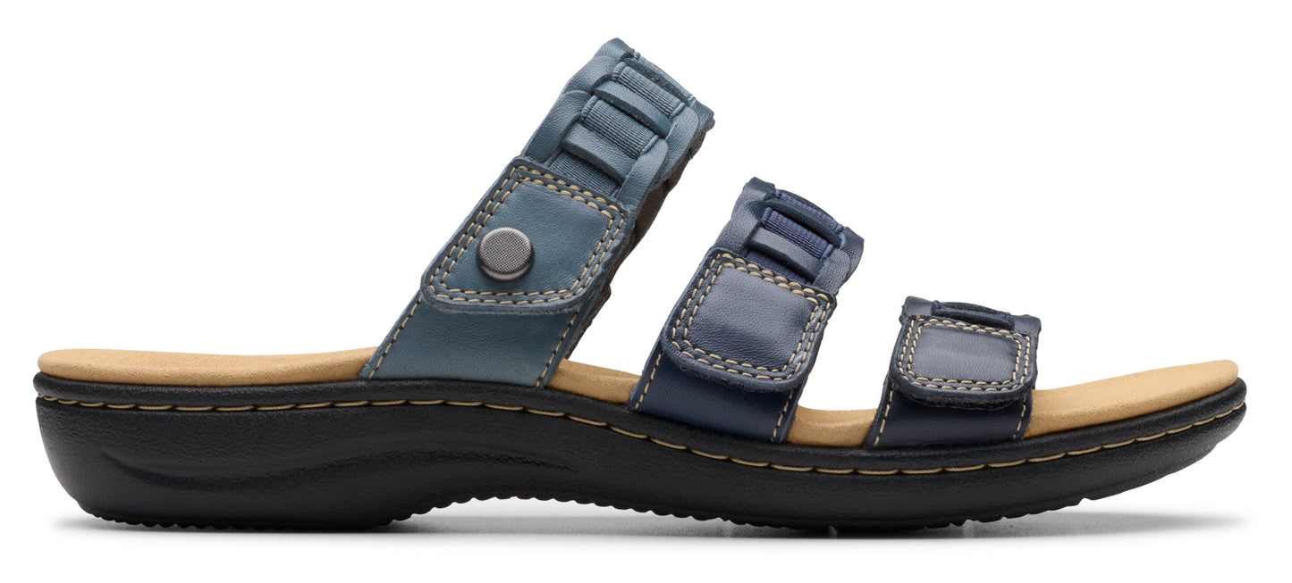 A blue sandal with three straps.