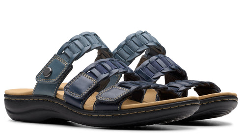 Pair of blue leather sandals with two straps, braided leather details, and black soles.