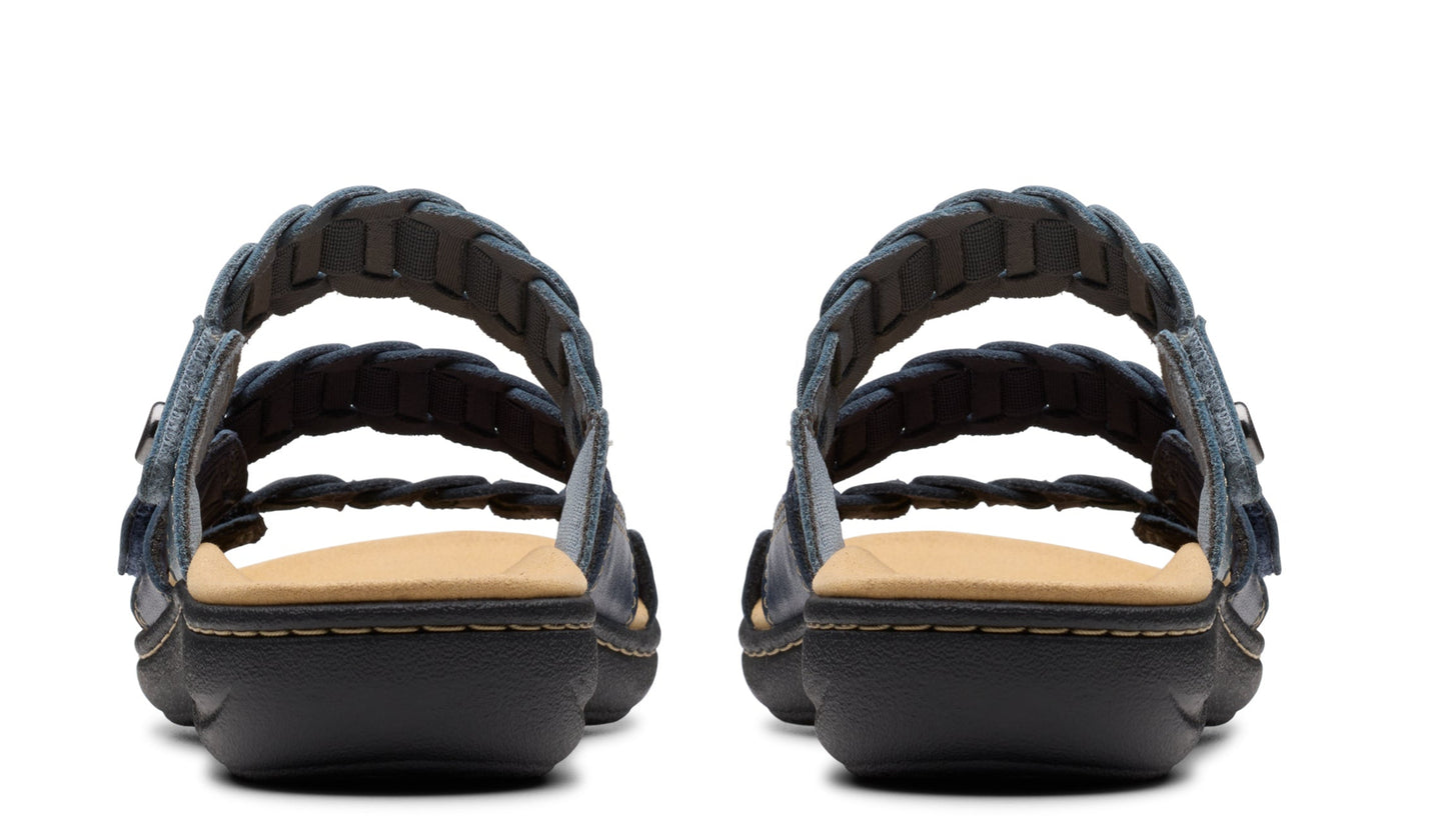 Pair of navy blue leather sandals with braided straps, viewed from the back.
