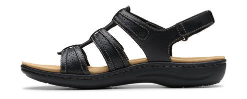 Black sandal with multiple straps and a velcro heel strap.