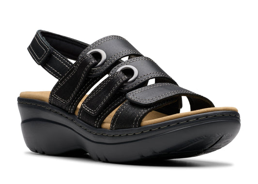 Black leather sandal with velcro straps and thick sole.