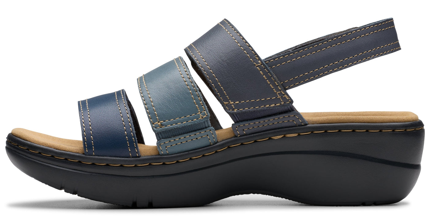 A woman's sandal with a black sole, three straps across the toes, and a slingback strap.