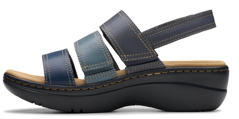 A woman's sandal with a black sole, three straps across the toes, and a slingback strap.