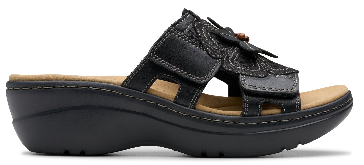 Black sandal with a flower design.