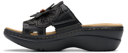 Black sandal with a flower on the front.