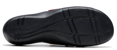 The sole of a black sandal with a grid-like pattern.