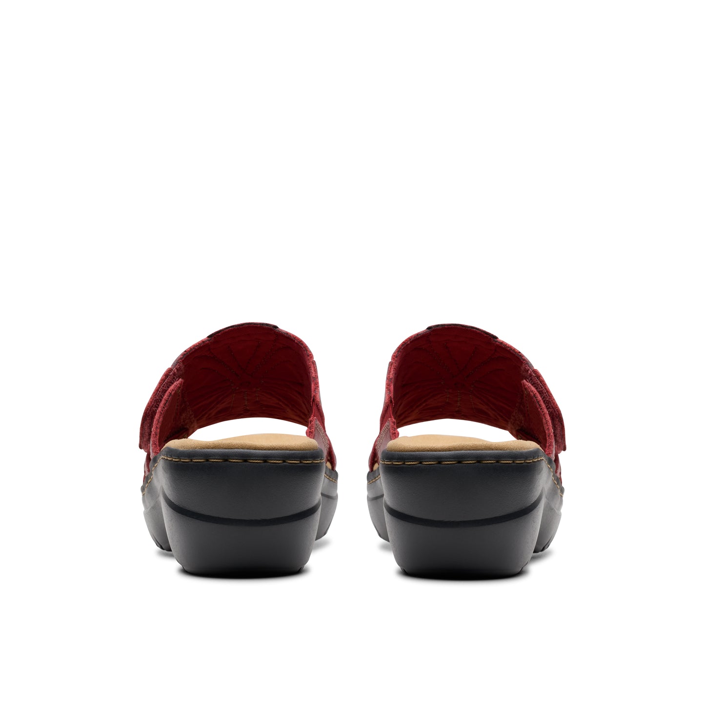 Rear view of platform sandals with red straps.