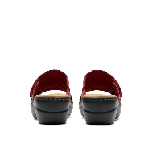 Rear view of platform sandals with red straps.