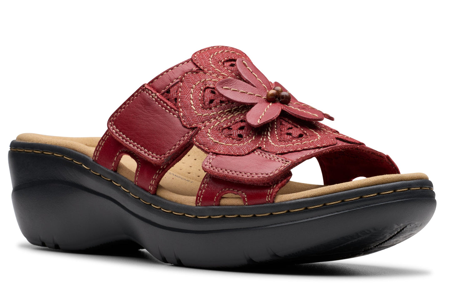 Red leather slide sandal with flower detail and black platform sole.