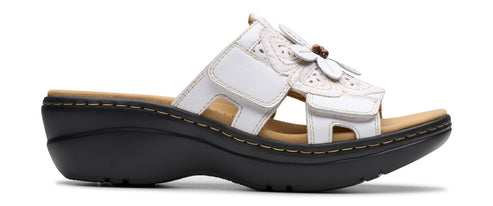 White sandal with flower decorations.