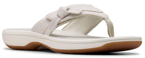 A beige flip-flop sandal with a bow.