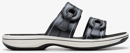 A black sandal with a white sole and two adjustable straps.