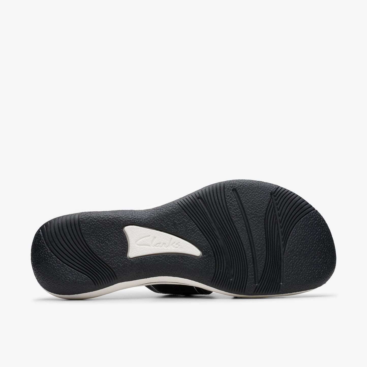 Black and white sandal sole with ridged pattern.